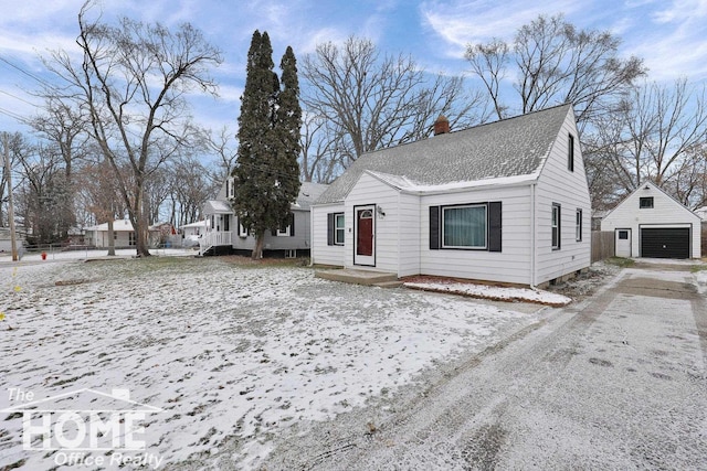 view of front of property with an outdoor structure and a garage