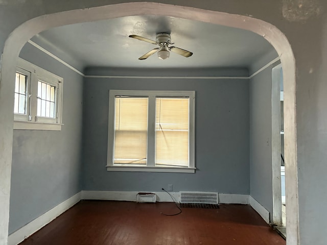 empty room featuring ceiling fan and dark hardwood / wood-style floors