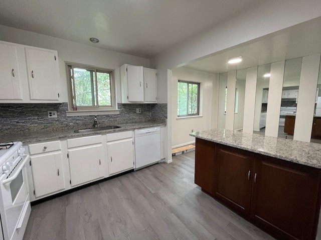 kitchen featuring sink, white cabinets, white appliances, and light wood-type flooring