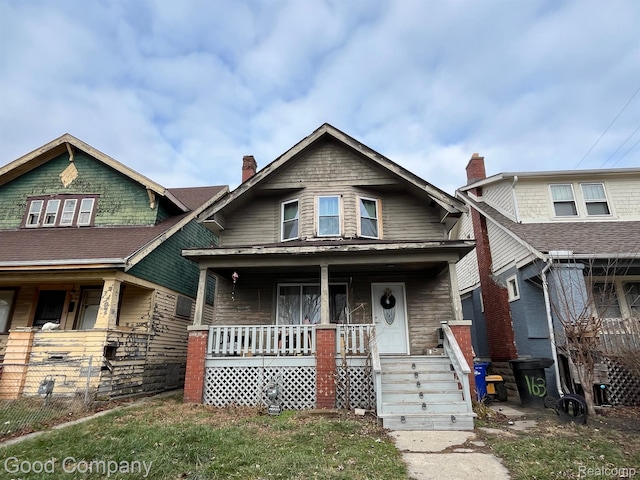 1636 Fullerton St, Detroit, MI 48238 - view of front of home with a porch and a chimney