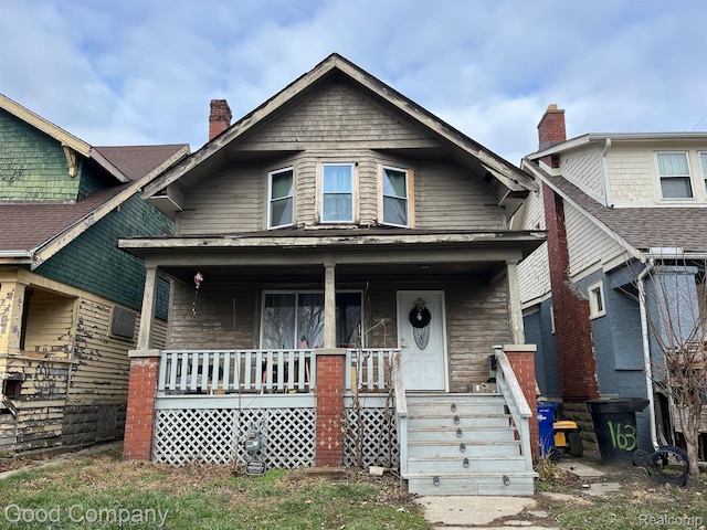 1636 Fullerton St, Detroit, MI 48238 - view of front of property featuring covered porch and a chimney