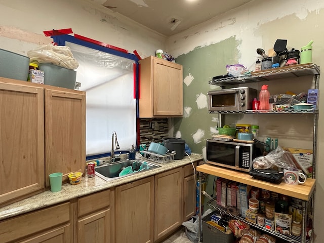 kitchen with tasteful backsplash and sink