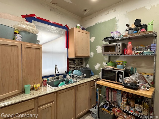 1636 Fullerton St, Detroit, MI 48238 - kitchen featuring stainless steel microwave, light countertops, and light brown cabinets