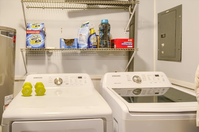 laundry area featuring washing machine and dryer, water heater, and electric panel