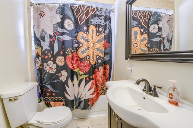 bathroom featuring vanity, a shower with shower curtain, tile patterned floors, and toilet