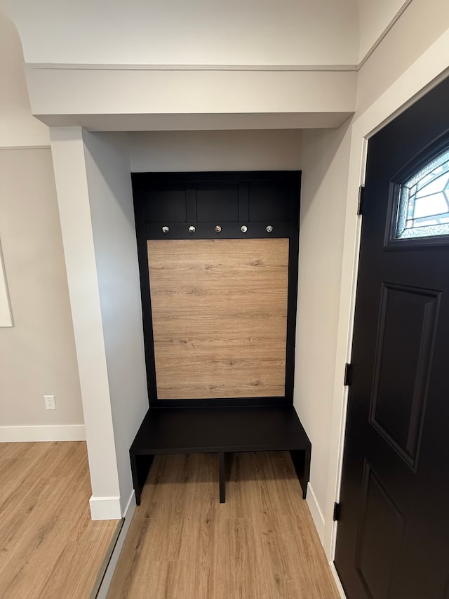 mudroom with light wood-type flooring and baseboards