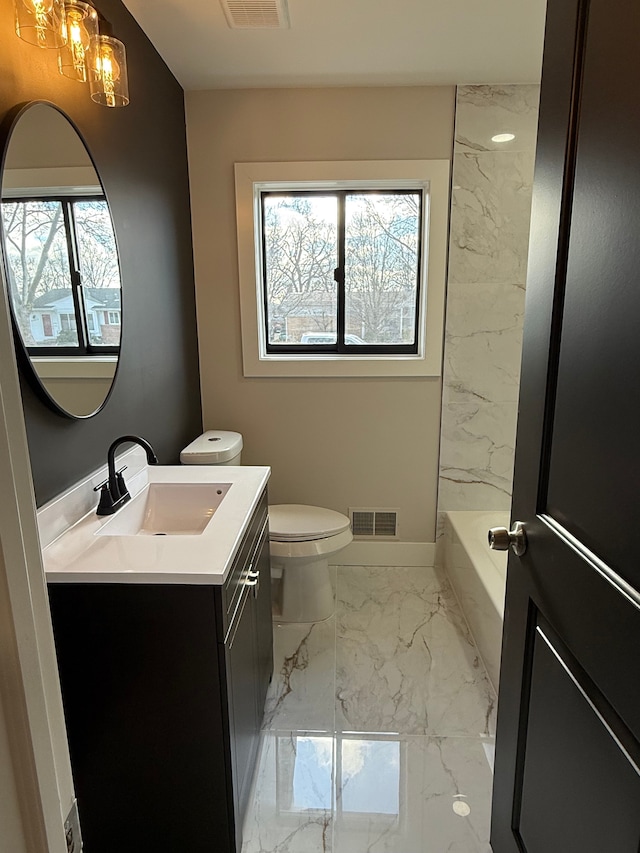 bathroom featuring toilet, vanity, visible vents, baseboards, and marble finish floor