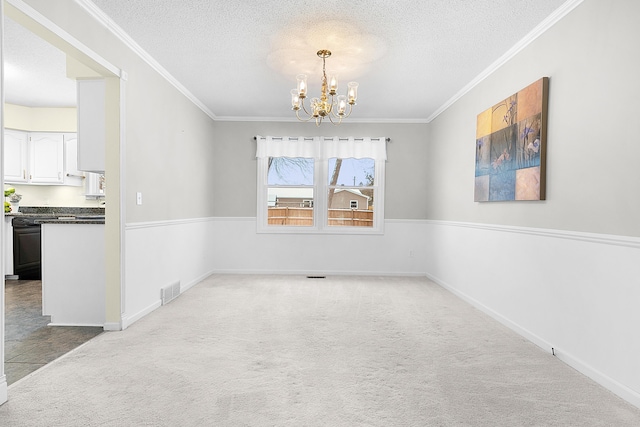 unfurnished dining area featuring a textured ceiling, a notable chandelier, ornamental molding, and light carpet