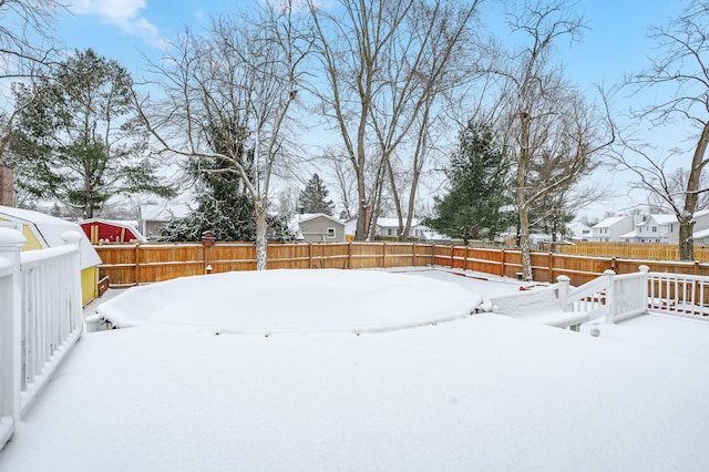 view of yard covered in snow