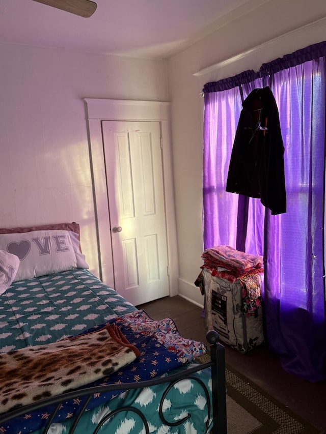 bedroom featuring ceiling fan and a closet