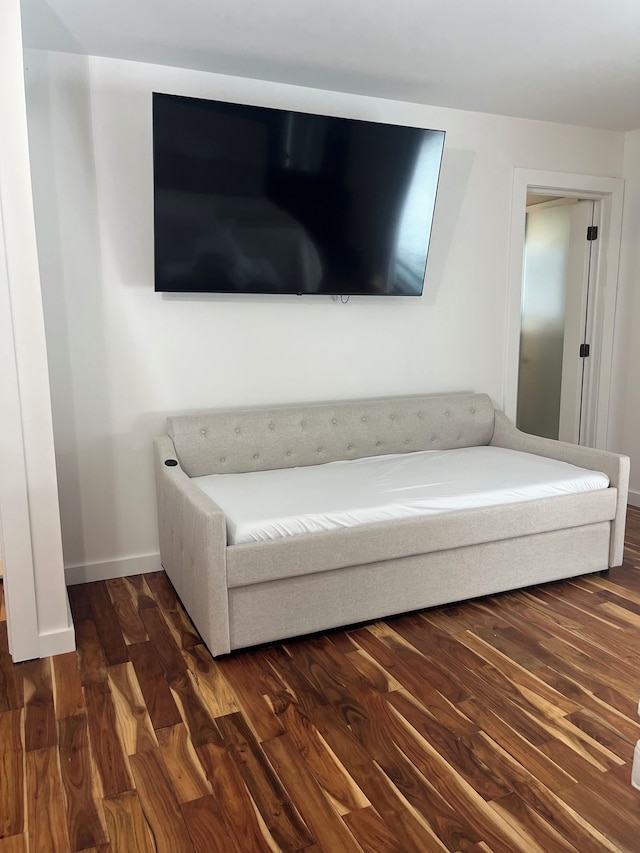 unfurnished living room featuring dark hardwood / wood-style flooring