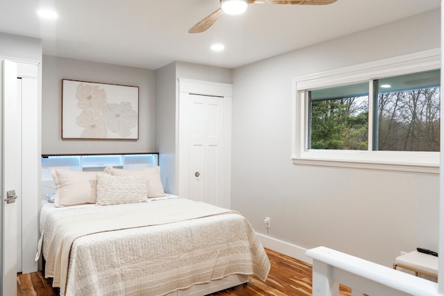 bedroom featuring ceiling fan and hardwood / wood-style floors