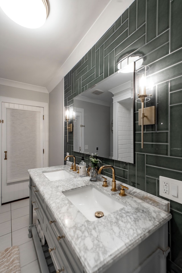 bathroom featuring ornamental molding, tile patterned floors, and vanity