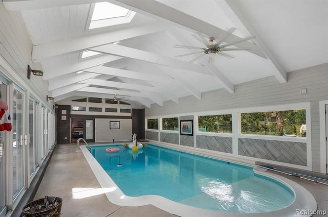 view of swimming pool featuring ceiling fan and a skylight