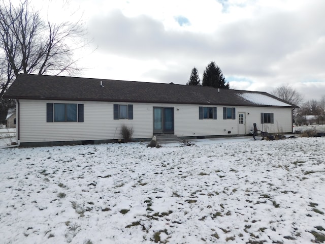 view of snow covered property