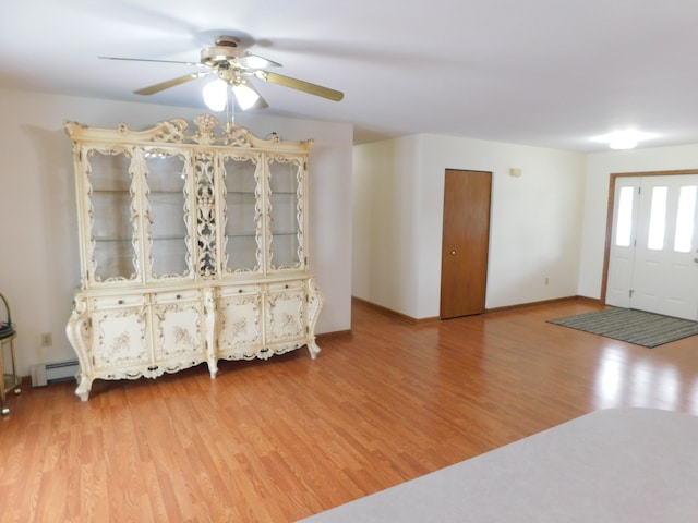 foyer entrance featuring hardwood / wood-style floors and ceiling fan