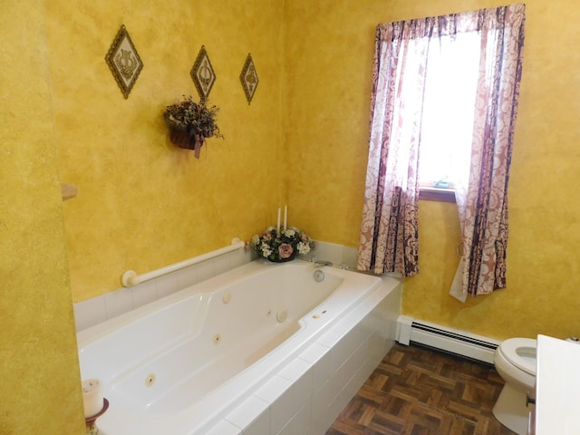 bathroom featuring a relaxing tiled tub, toilet, parquet flooring, and baseboard heating