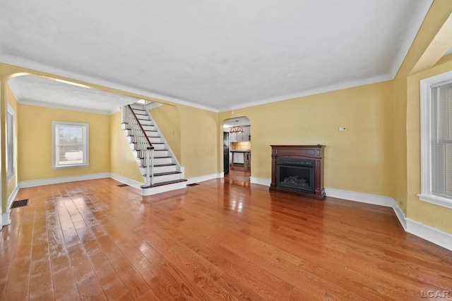 unfurnished living room featuring wood-type flooring