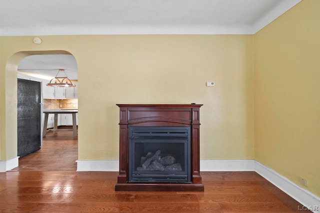 unfurnished living room with dark wood-type flooring