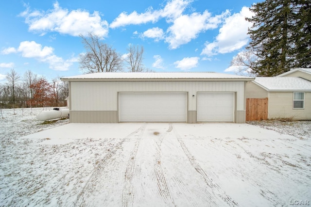 view of snow covered garage