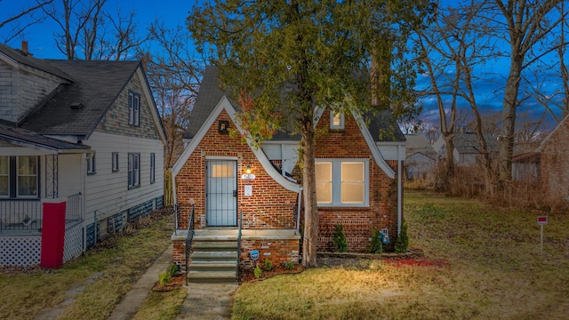 view of front of home with a yard