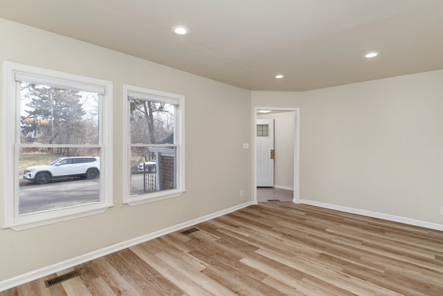 unfurnished room featuring light wood-type flooring