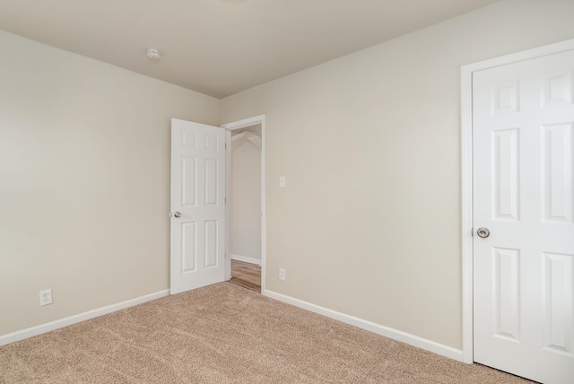 unfurnished room with carpet floors