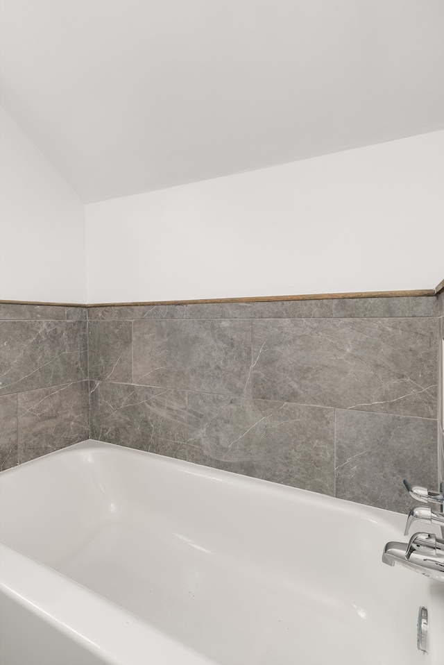 bathroom featuring a washtub