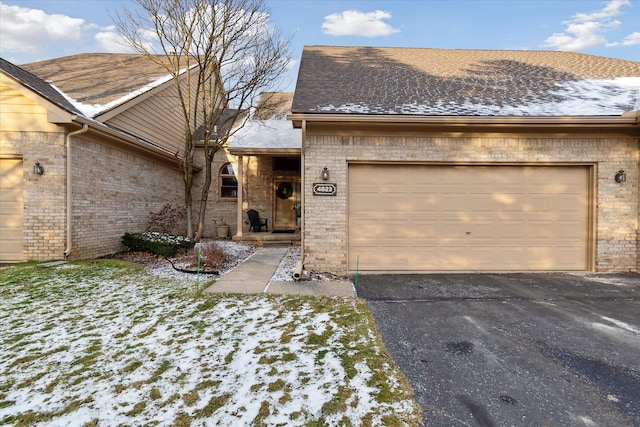 ranch-style home featuring a garage