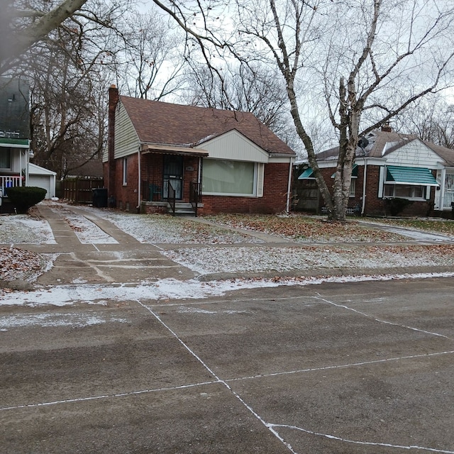 view of front facade with a garage and an outdoor structure