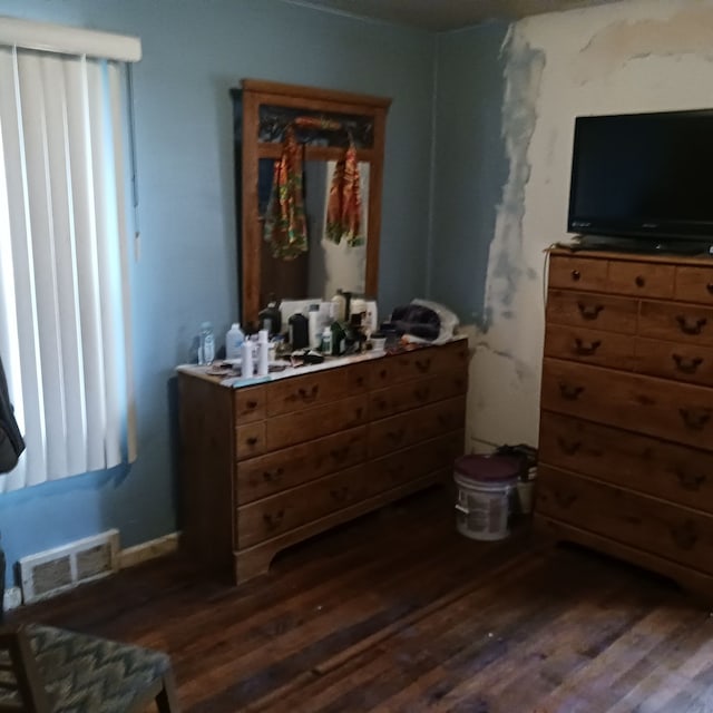 bedroom featuring dark hardwood / wood-style flooring