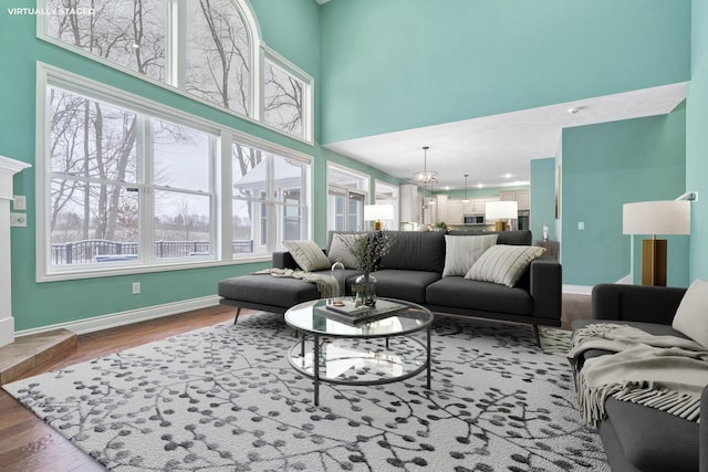 living room featuring a chandelier and hardwood / wood-style floors