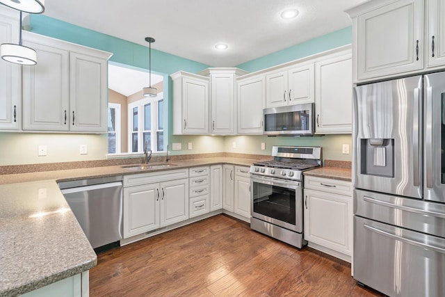 kitchen with white cabinetry and appliances with stainless steel finishes