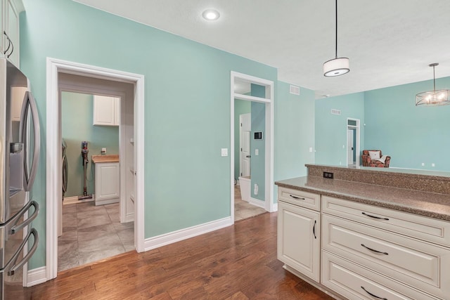 bathroom with vanity and hardwood / wood-style flooring