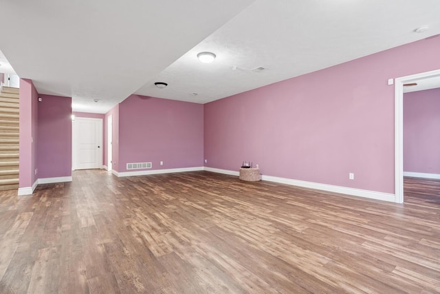 unfurnished living room with hardwood / wood-style flooring