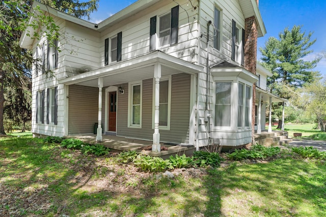 view of home's exterior featuring a porch
