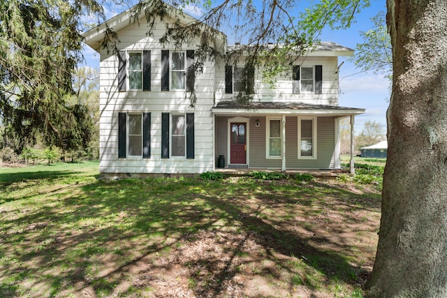view of front of home with a porch and a front yard