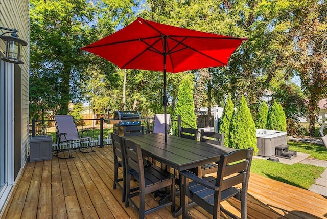 deck with central AC unit and a hot tub