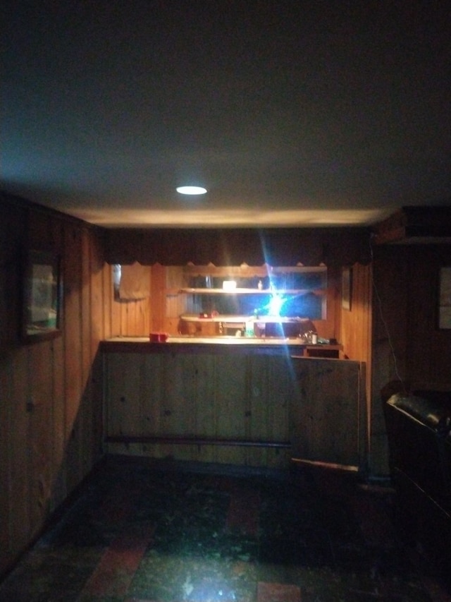 bar featuring wood walls