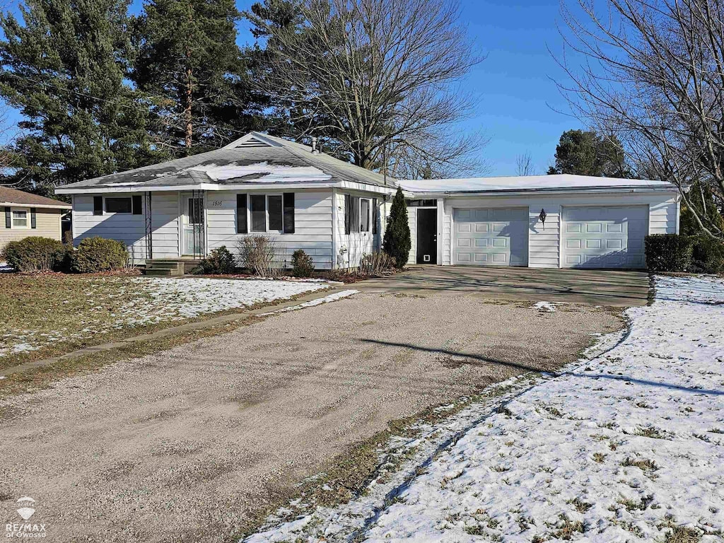 ranch-style house featuring a garage