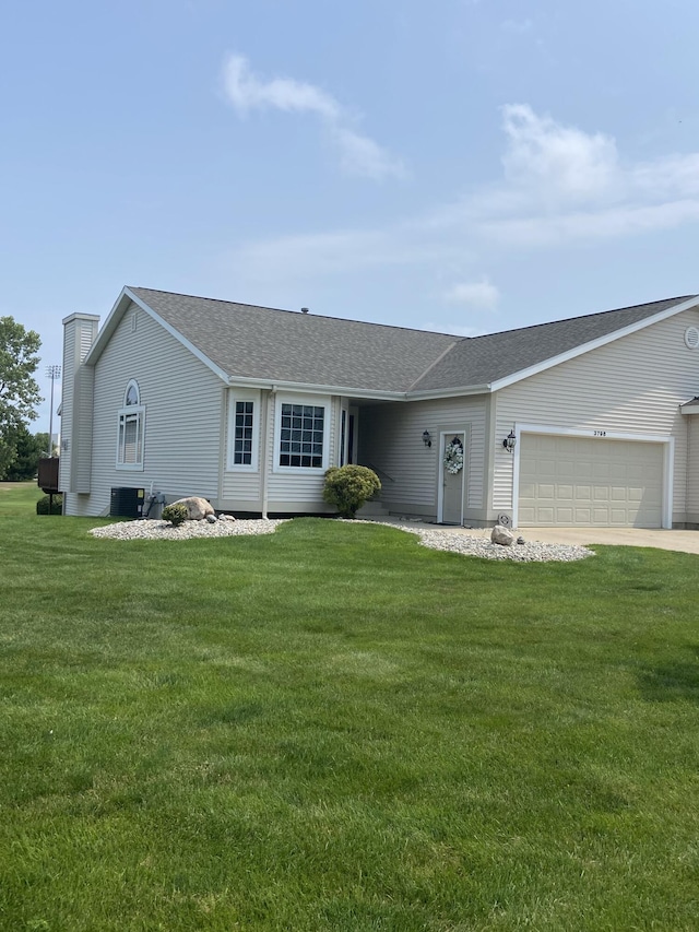 ranch-style house with central AC unit, a garage, and a front lawn