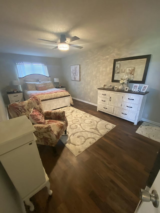 bedroom featuring dark hardwood / wood-style floors and ceiling fan