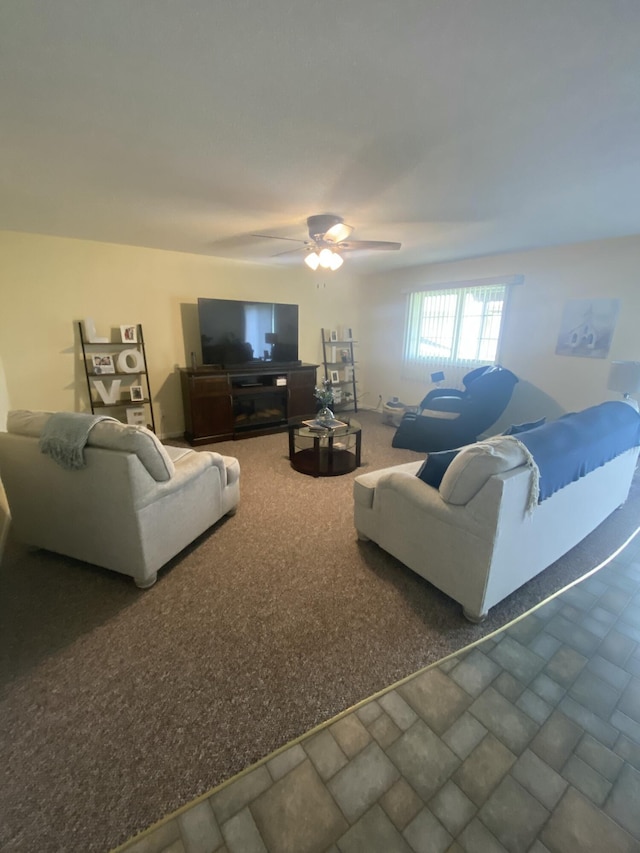 living room with dark carpet and ceiling fan