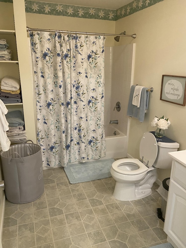 full bathroom with vanity, toilet, and shower / bath combo