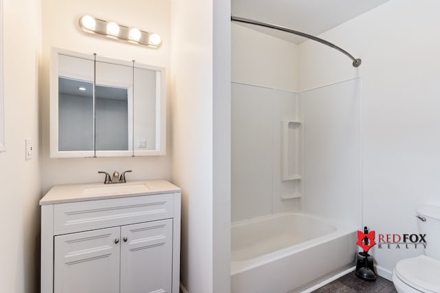 full bathroom featuring shower / bathing tub combination, vanity, and toilet