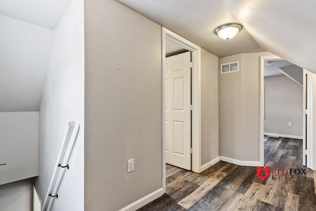 additional living space with dark hardwood / wood-style floors and lofted ceiling