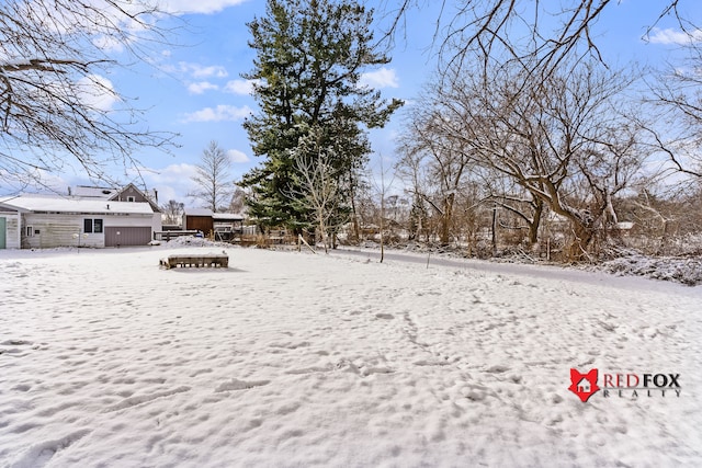 view of yard layered in snow