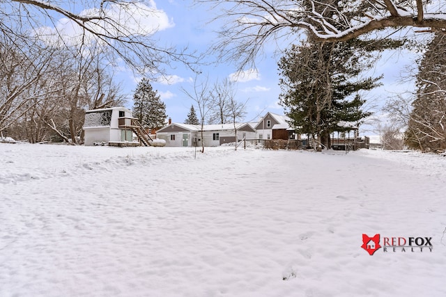 view of yard covered in snow