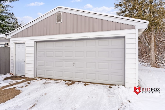 view of snow covered garage