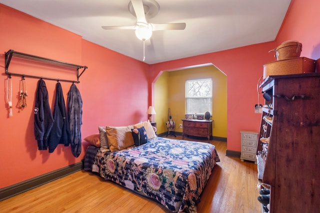 bedroom with ceiling fan and light wood-type flooring